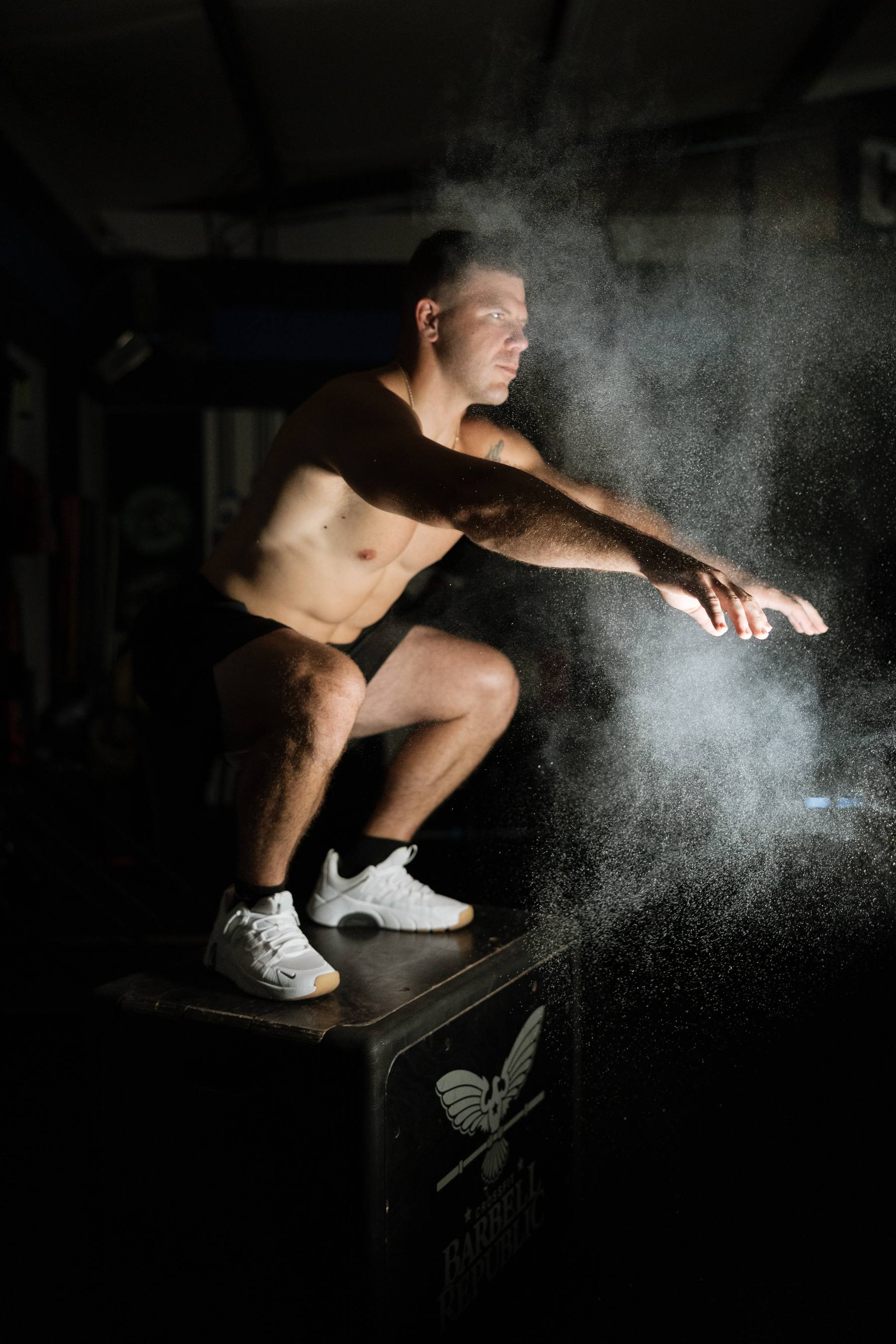 Athlete clapping chalk before a set